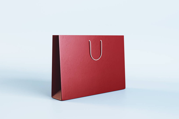 Empty red shopping bag with mock up place on white background. Christmas, present and packaging concept. 3D Rendering - 写真・画像