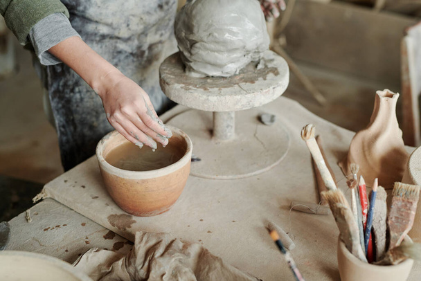 Woman creating clay vase in studio - Photo, Image