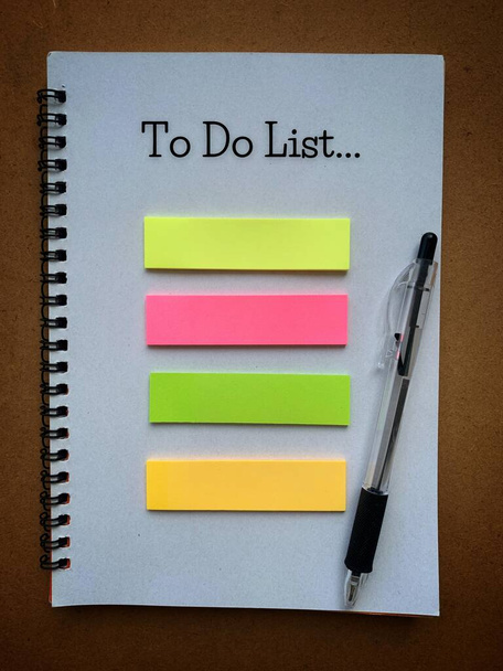 To Do List text on notepad with pen and colorful sticky note. Business concept - Photo, Image
