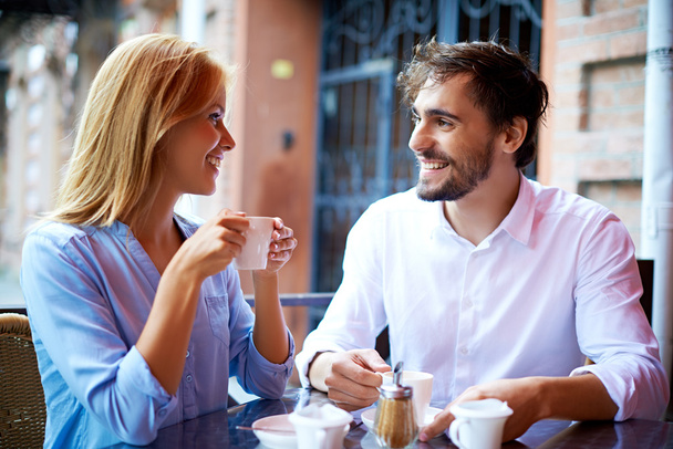 Affectionate couple having coffee in cafe - Fotoğraf, Görsel