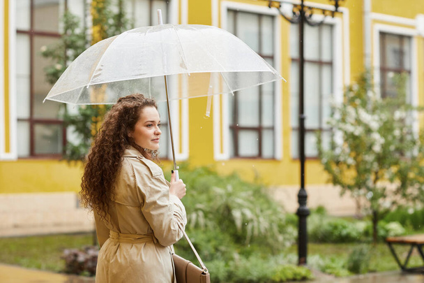 Young Woman On Rainy Spring Day - Photo, Image