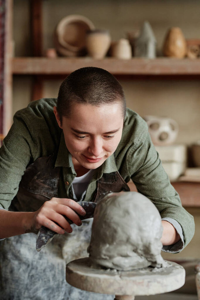 Professional potter making bowl in pottery workshop - Photo, Image