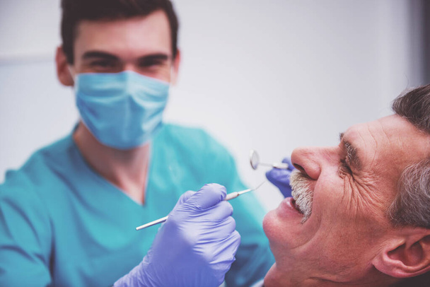 Close-up. Elderly man on reviewing the dentist - Photo, Image