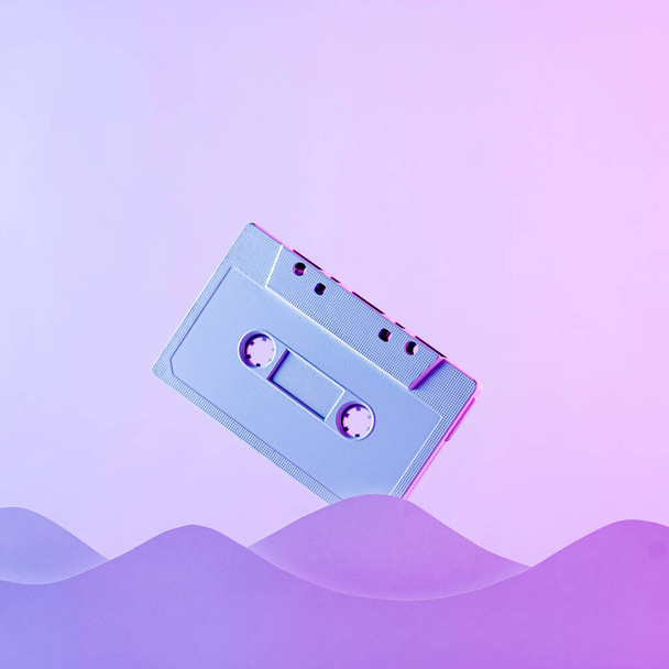 Trend cyber audio poster cassette and wave in neon seating in retro style 90s. Minimal vaporwave concept. - Zdjęcie, obraz