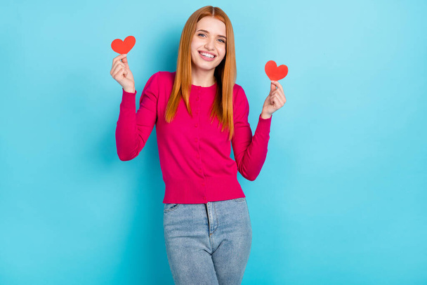 Photo of young millennial foxy head lady hold hearts wear pink sweater jeans isolated on blue color background - Foto, afbeelding