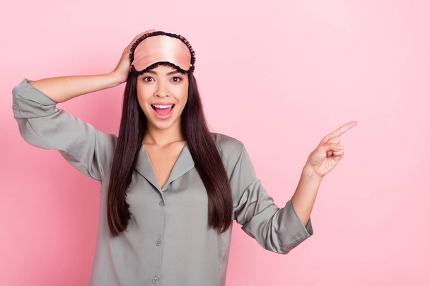 Portrait of attractive amazed trendy cheerful girl indicating copy space like follow subscribe isolated over pink pastel color background - Foto, afbeelding