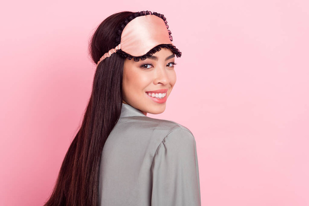 Profile side view portrait of attractive cheerful girl wearing silky blindfold posing isolated over pink pastel color background - Zdjęcie, obraz