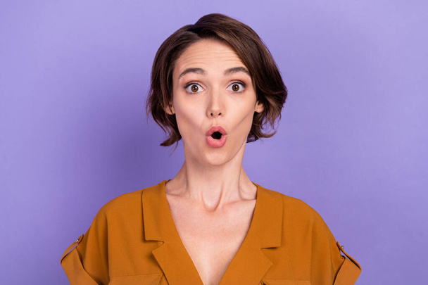 Photo of young woman amazed shocked fake novelty news information gossip isolated over violet color background - Fotografie, Obrázek