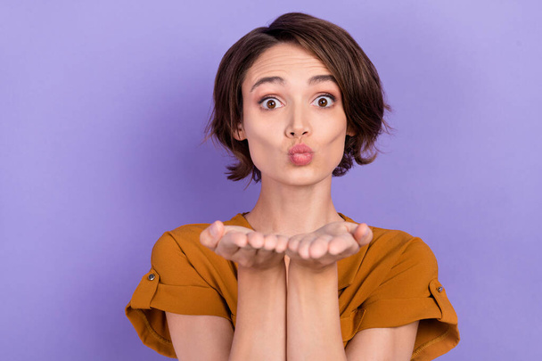 Photo of young attractive woman pouted lips send air kiss you flirty romantic isolated over purple color background - 写真・画像