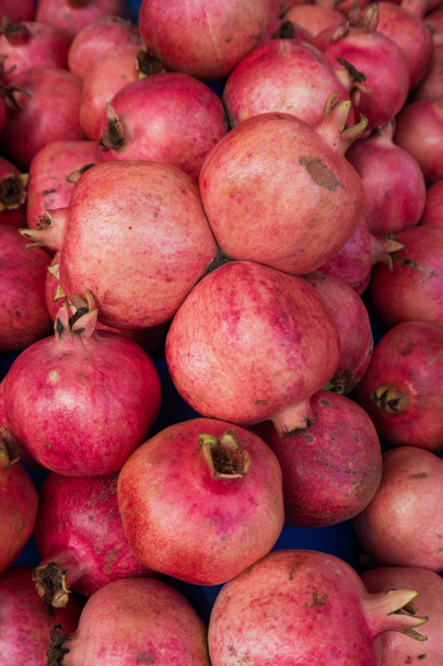 group of pomegranates.  pomegranate closeup, background  - Foto, imagen