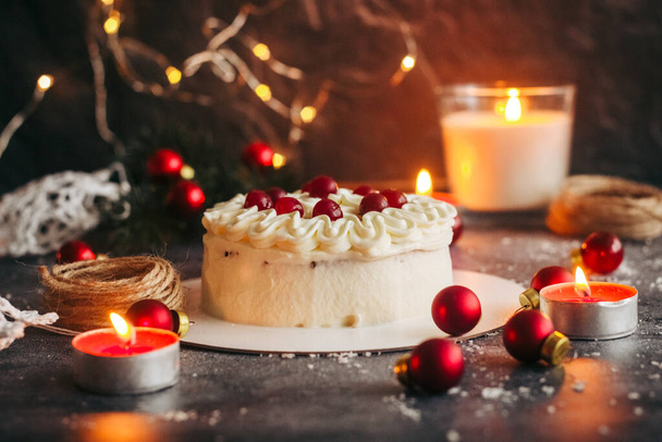 Christmas cake. Delicious cake with winter decor. Lingonberry cake on the table  - Valokuva, kuva