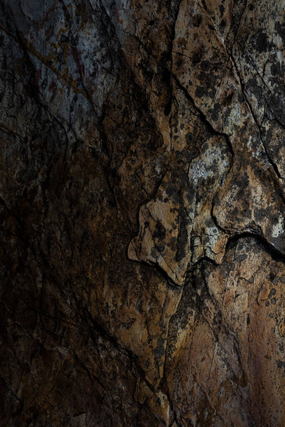 Old rusty granite rock with lots of cracks, grungy background. - Φωτογραφία, εικόνα