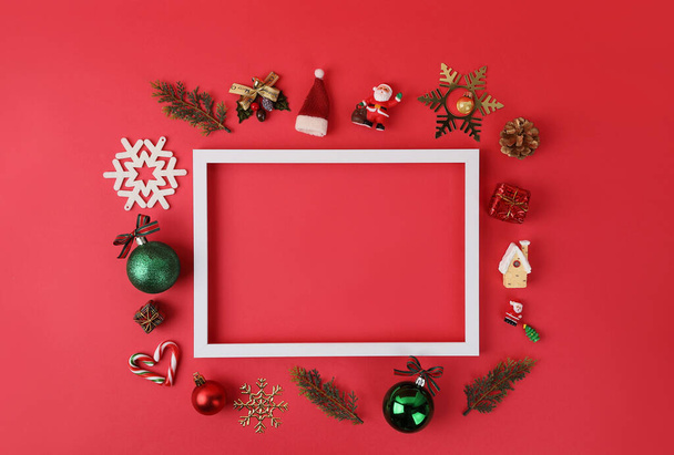 Christmas ornaments in square frame, red background - Zdjęcie, obraz