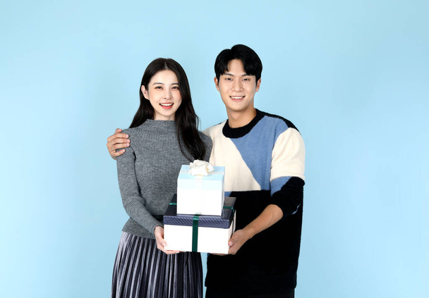 Asian Korean couple with gift box, promotion and sale concept - 写真・画像