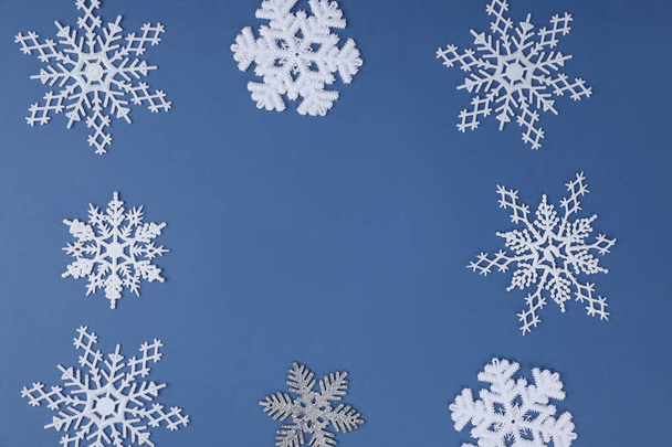 blue background with Christmas and snow ornaments - 写真・画像