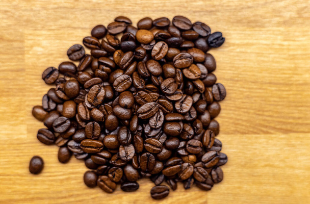 coffee beans on wooden background - Fotó, kép