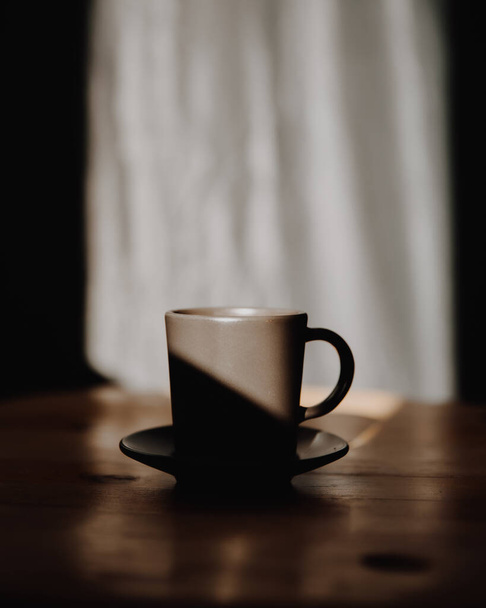 mug of coffee on wooden table - 写真・画像
