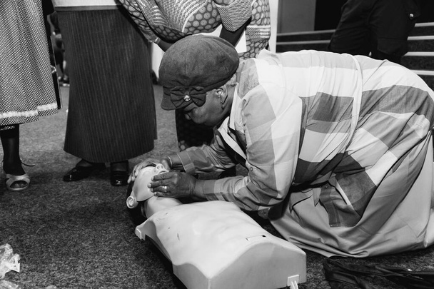 Johannesburg, South Africa - November 5, 2014: First Aid CPR training with plastic dummy - 写真・画像