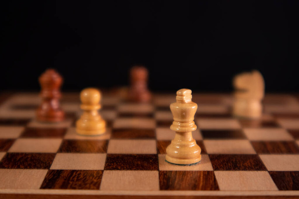 chess pieces on black background - Фото, изображение