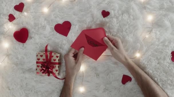 man with love letter for st valentine day cropped video  - Footage, Video