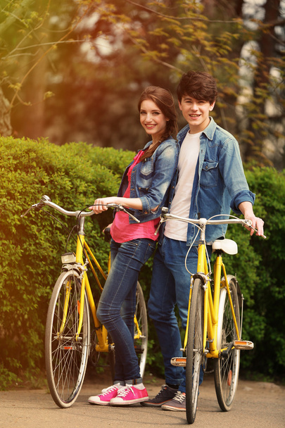 Young couple with bicycles - Фото, зображення