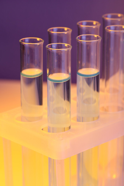 Test tubes with liquid on dark background - Foto, imagen