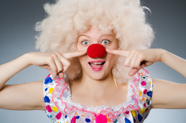 Clown with white wig against grey background - Photo, Image