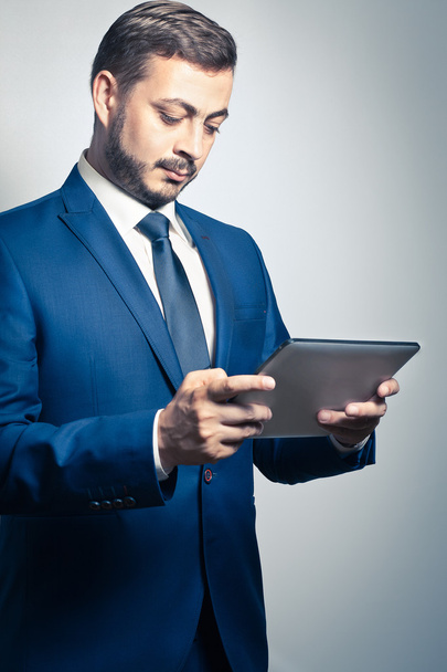 Businessman with tablet pc - Фото, изображение