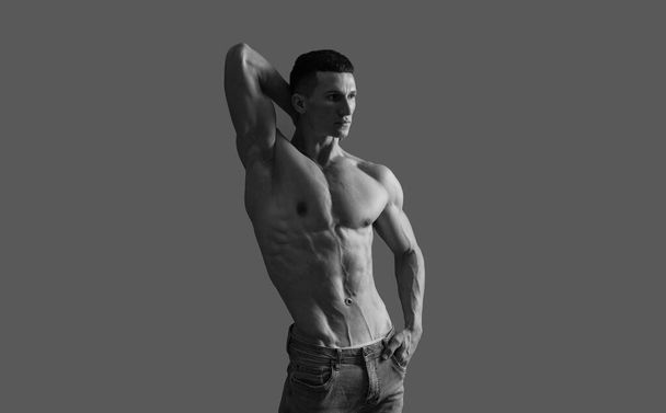 Fit guy with six pack abs torso pose shirtless grey background, muscle - Photo, Image