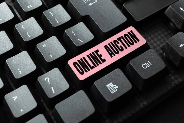 Sign displaying Online Auction. Concept meaning digitized sale event which item is sold to the highest bidder Typing Online Class Review Notes, Abstract Retyping Subtitle Tracks - Photo, Image