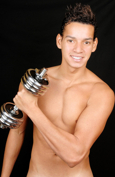 Young man with dumbbell - Photo, Image