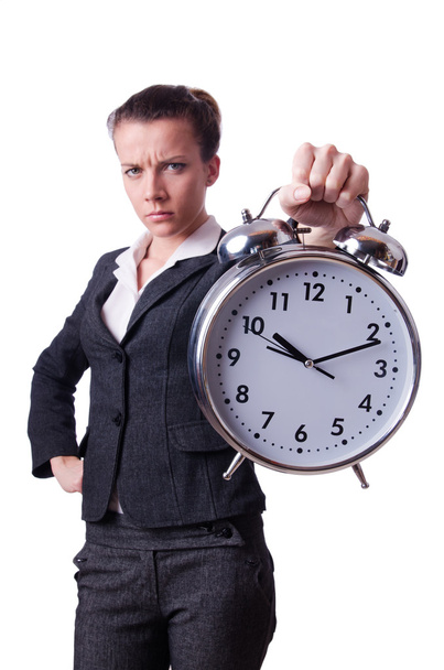 Businesswoman with clock missing her deadlines - Φωτογραφία, εικόνα