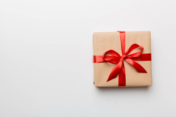 Holiday present box over colored background, top view. Copy space for design. - 写真・画像