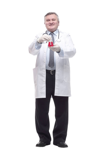 friendly doctor with a laboratory flask. isolated on a white background. - Zdjęcie, obraz