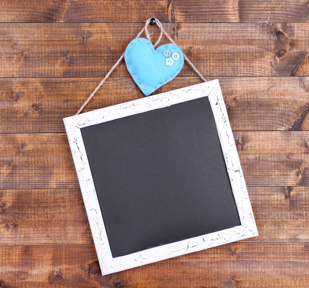 Square chalkboard on wooden background - Photo, image