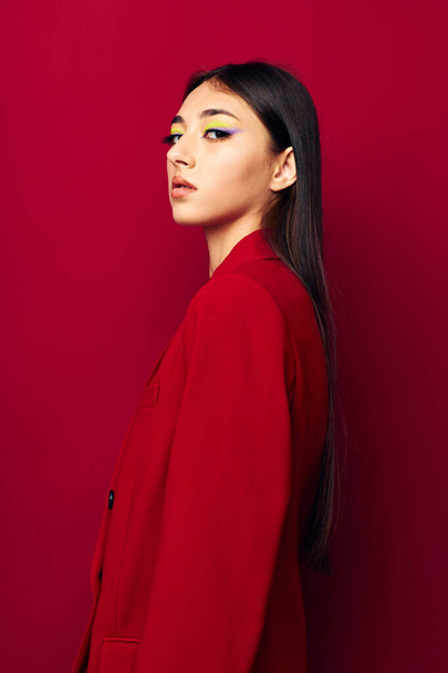 beautiful brunette bright makeup red jacket posing studio model unaltered - Valokuva, kuva