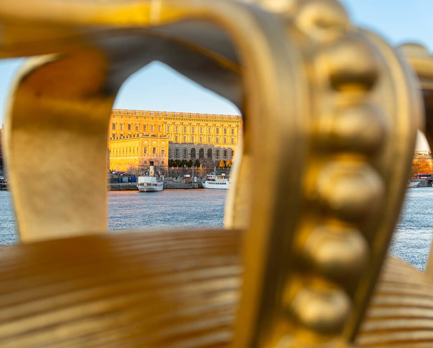 Stockholm, Sweden - October 19, 2021: Look through the frame of golden crown on the bridge - Foto, Bild