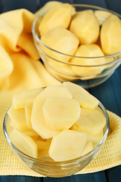 Sliced potatoes in bowls - Fotoğraf, Görsel