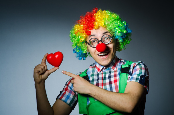 Clown with red heart in romantic concept - Photo, Image