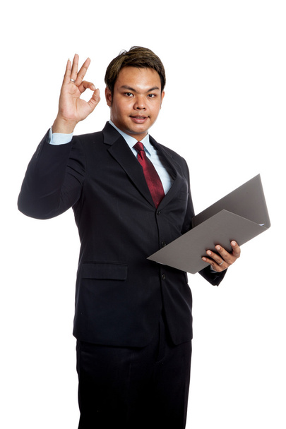 Asian businessman show ok sign with a report - Фото, изображение