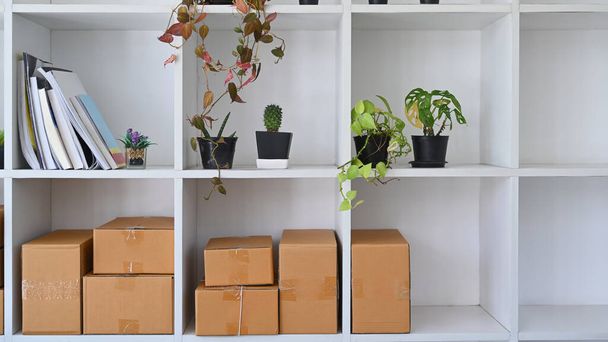 Cardboard boxes at warehouse. Online selling, e-commerce and shipping concept - Foto, Bild