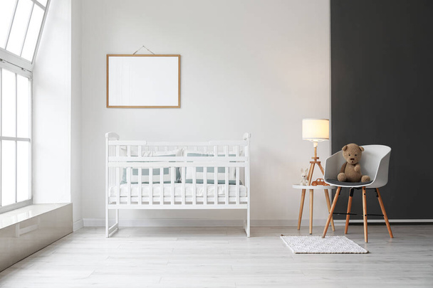 Interior of modern children's room with comfortable crib - Photo, image