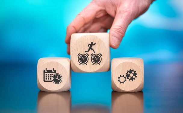 Wooden blocks with symbol of time management concept on blue background - Photo, Image