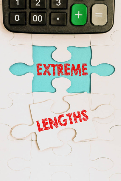 Hand writing sign Extreme Lengths. Conceptual photo Make a great or extreme effort to do something better Building An Unfinished White Jigsaw Pattern Puzzle With Missing Last Piece - Photo, Image