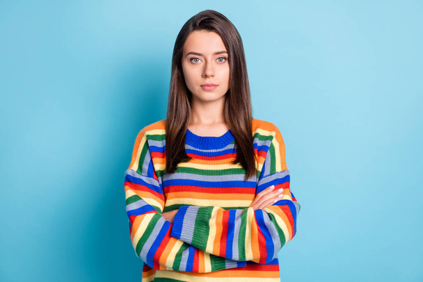 Portrait of attractive serious brown-haired girl folded arms isolated over vibrant blue color background - Photo, Image