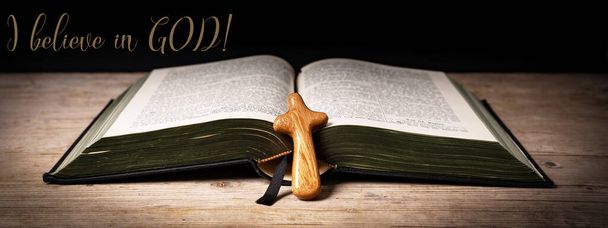 I believe in GOD ! Church faith Christian background banner panorama - Old holy bible and cross on old rustic vintage wooden table - Фото, зображення