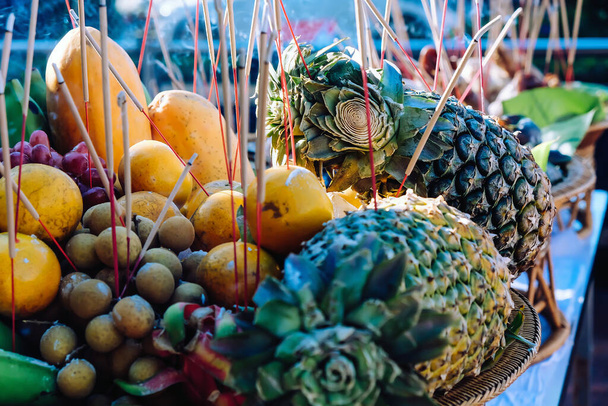 Offer sacrifices to one's anxestors, Close up Image of Sacrificial offering food for pray to god and memorial to ancestor, Traditional offerings to gods with food, vegetable and fruit - Photo, Image