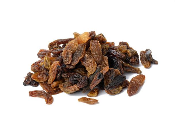 bunch of dried brown raisins isolated on white background - Photo, Image