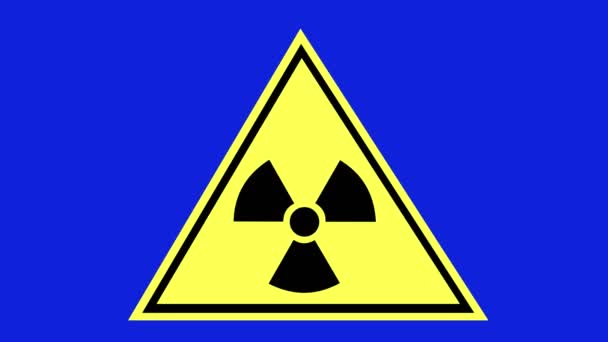 Loop animation of the radioactive risk symbol, on a blue chroma key background - Materiał filmowy, wideo