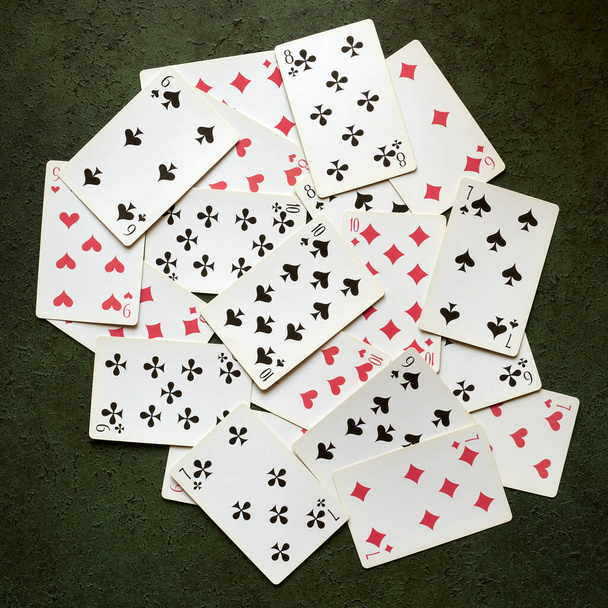 Old playing cards scattered on the table - Фото, изображение
